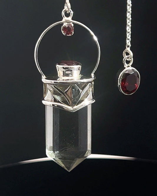 Straight 12 facet Crystal Point w/ Facetted Garnet Accents in .925 Silver Setting w/ Fancy Cutwork Design as a Pendulum