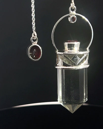 Straight 12 facet Crystal Point w/ Facetted Garnet Accents in .925 Silver Setting w/ Fancy Cutwork Design as a Pendulum