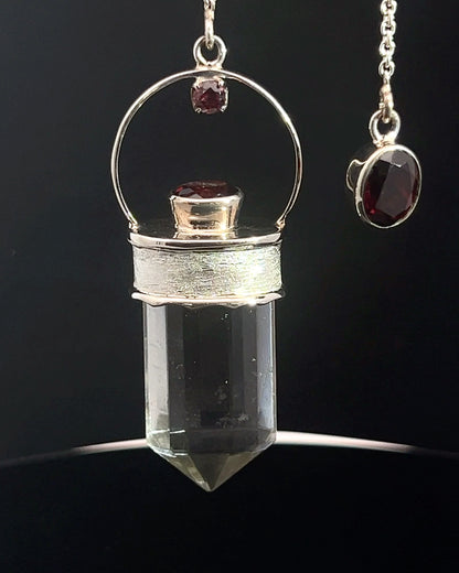 Straight 12 facet Crystal Point w/ Facetted Garnet Accents in .925 Silver Setting w/ Fancy Satin Silver Finish as a Pendulum