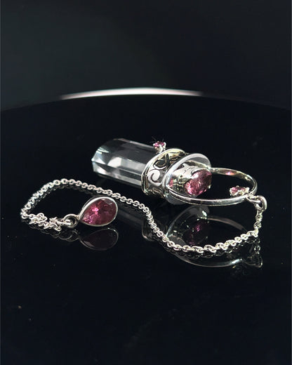Straight 12 facet Crystal Point w/ Facetted Red Turmaline Accents in .925 Silver Setting w/ Fancy Cutwork Patterns as a Pendulum