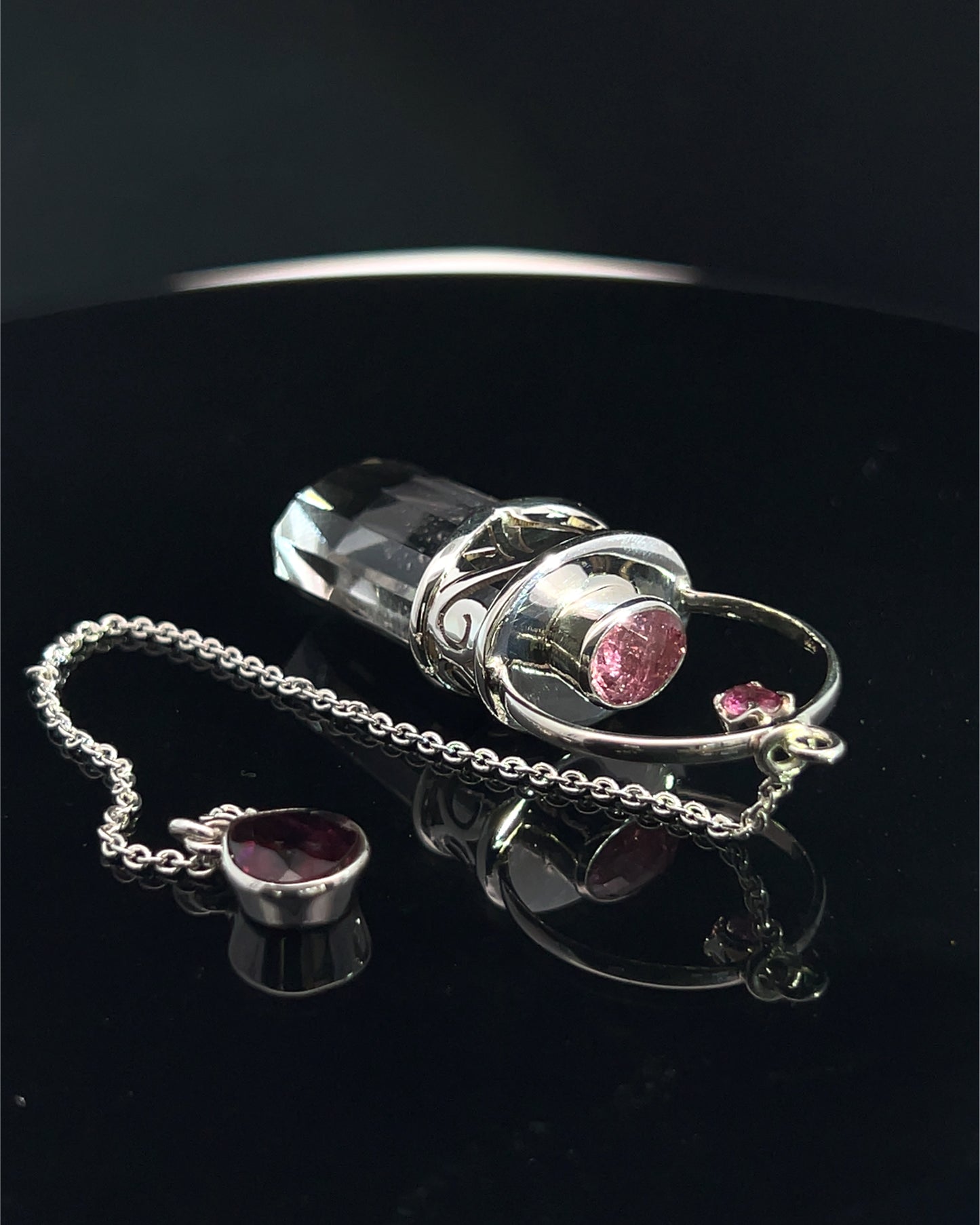 Straight 12 facet Crystal Point w/ Facetted Red Turmaline Accents in .925 Silver Setting w/ Fancy Cutwork Patterns as a Pendulum