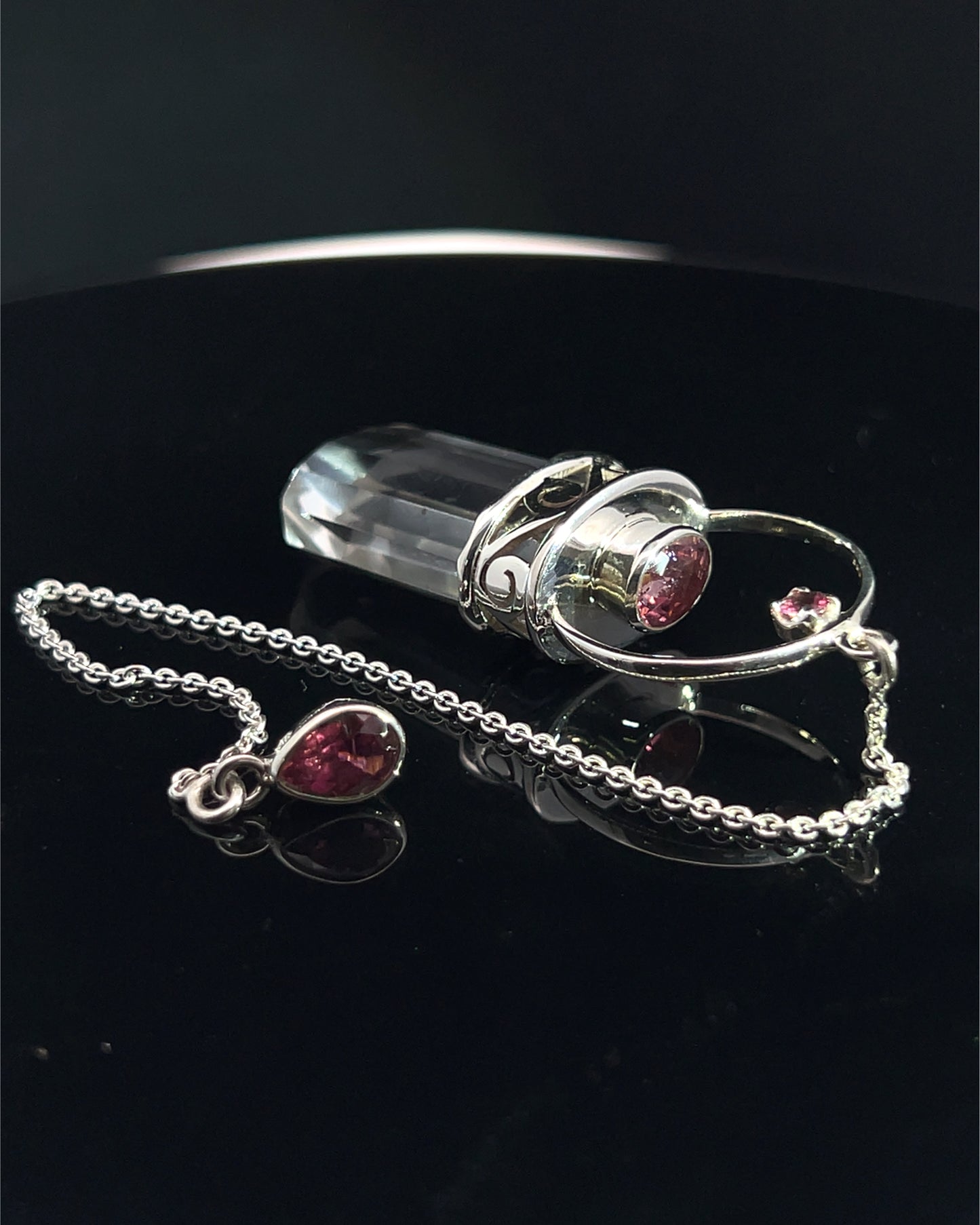 Straight 12 facet Crystal Point w/ Facetted Red Turmaline Accents in .925 Silver Setting w/ Fancy Cutwork Patterns as a Pendulum