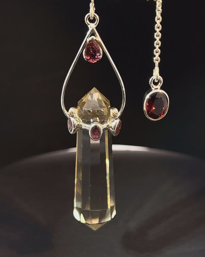 Vogel Cut Double Terminated Crystal Point with 7 Facetted Red Turmalines in .925 Silver Setting  as a Pendulum