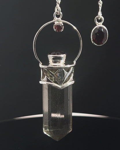 Straight 12 facet Crystal Point w/ Facetted Garnet Accents in .925 Silver Setting w/ Fancy Cutwork Design as a Pendulum