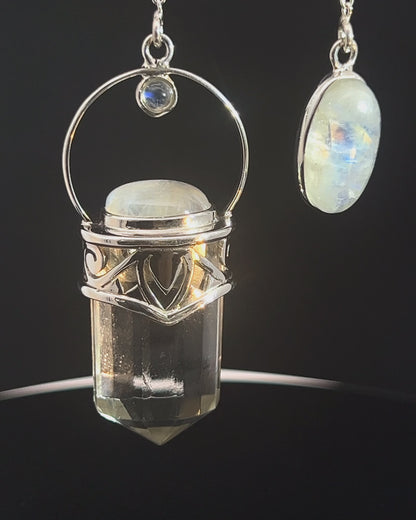 Straight 12 facet Crystal Point w/ Rainbow Moonstone Cabachons Accents and Finger Loop in Fancy .925 Silver Setting w/ Fancy Cutwork Design as a Pendulum