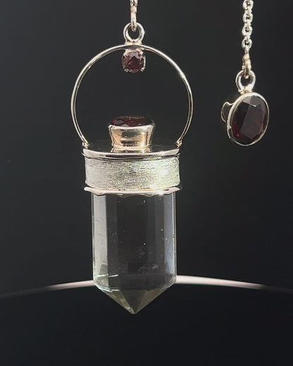 Straight 12 facet Crystal Point w/ Facetted Garnet Accents in .925 Silver Setting w/ Fancy Satin Silver Finish as a Pendulum