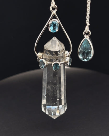 Vogel Cut Double Terminated Crystal Point w/ 8 Facetted Blue Topaz in .925 Silver Setting  as a Pendulum
