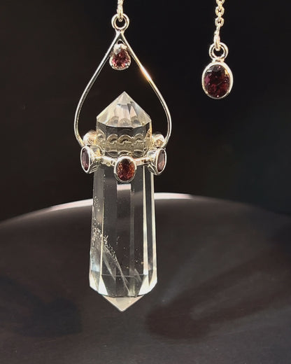 Vogel Cut Double Terminated Crystal Point with 7 Facetted  Red Turmalines in .925 Silver Setting  as a Pendulum